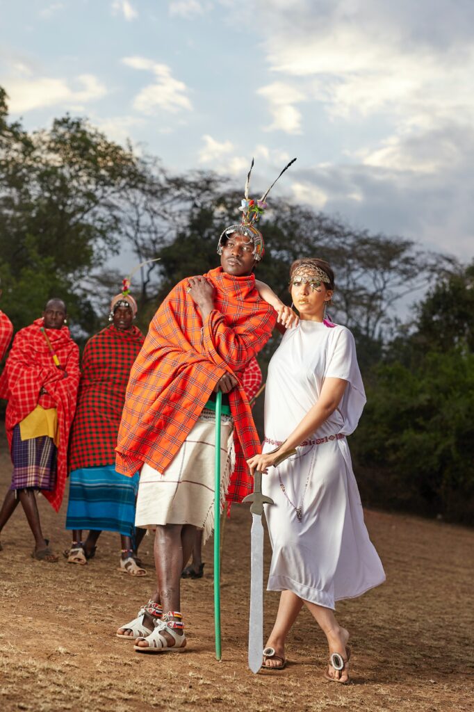 A picture of a Maasai man and a tourist to hep depict the concept of sustainable tourism