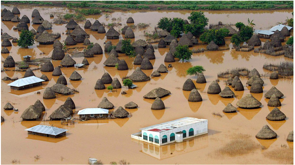 An image of a flooded village in Kenya with grass-thatched houses submerged in water, part of practical scenarios students will explore studying abroad