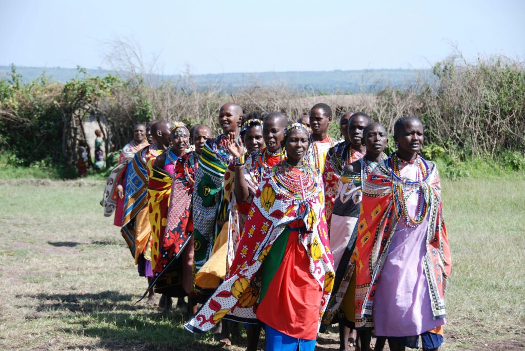A picture of Maasai women wearing lessos and beads, a traditional attire, to show you some of the cultures you'll explore during your study abroad trip
